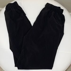Polyester/Spandex jogger pants. Slightly strechy